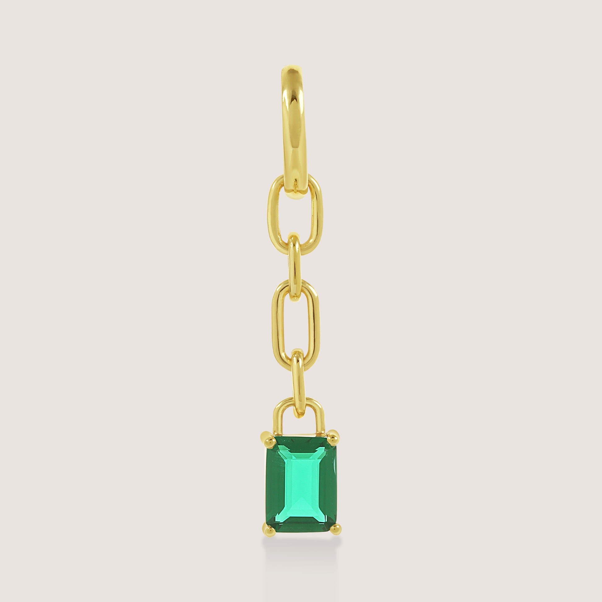 White Background - Close-up of KiraKira Emerald Danglers | 925 Silver Gold-Plated from Nishani’s Kira Kira festive collection — handcrafted emerald jewelry, earrings in gold-plated 925 silver.