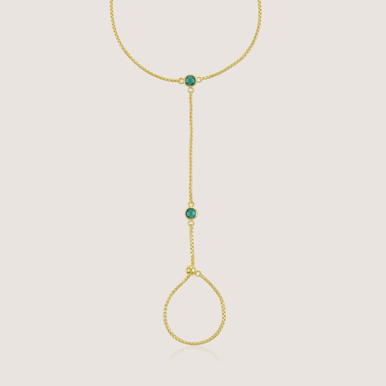 White Background - Close-up of KiraKira Emerald Hand Chain | 925 Silver Gold-Plated from Nishani’s Kira Kira festive collection — handcrafted emerald jewelry, bracelet in gold-plated 925 silver.