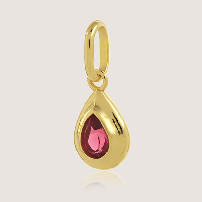White Background - Close-up of KiraKira Ruby Charm | 925 Silver Gold-Plated from Nishani’s Kira Kira festive collection — handcrafted ruby jewelry, charm in gold-plated 925 silver.