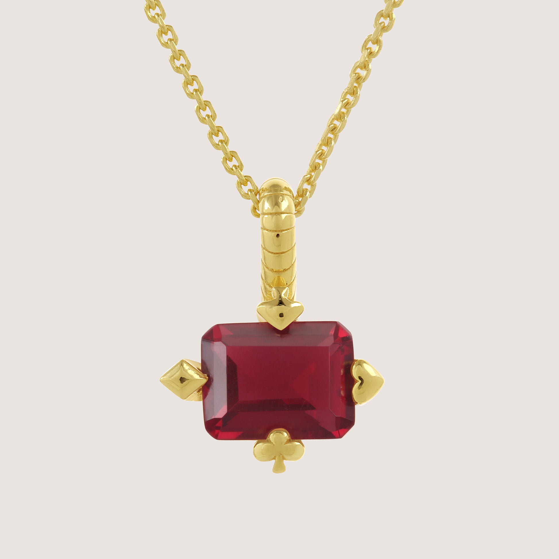 White Background - Close-up of KiraKira Ruby Suits Necklace | 925 Silver Gold-Plated from Nishani’s Kira Kira festive collection — handcrafted ruby jewelry, necklace in gold-plated 925 silver.
