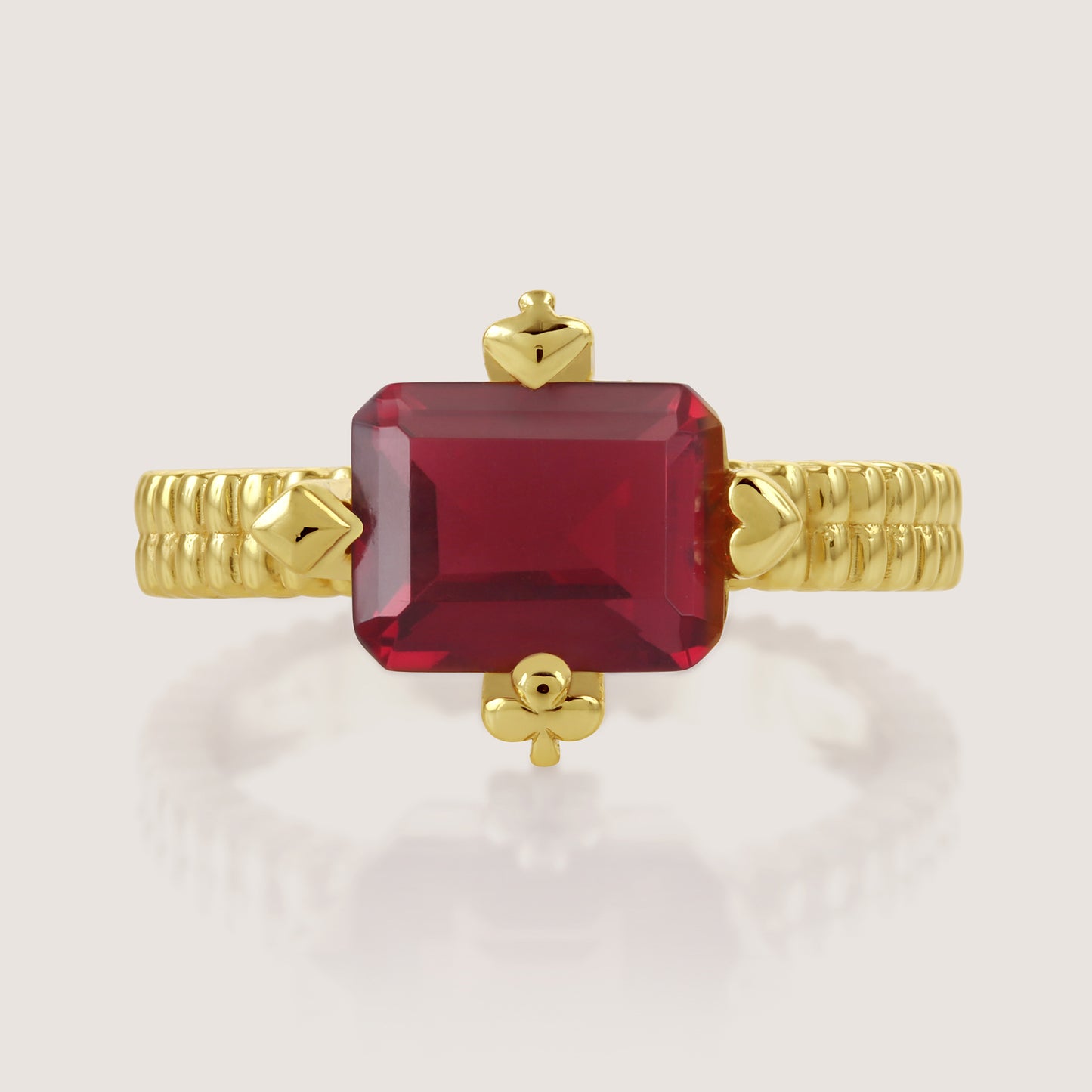 White Background - Close-up of KiraKira Ruby Suits Ring | 925 Silver Gold-Plated from Nishani’s Kira Kira festive collection — handcrafted ruby jewelry, ring in gold-plated 925 silver.