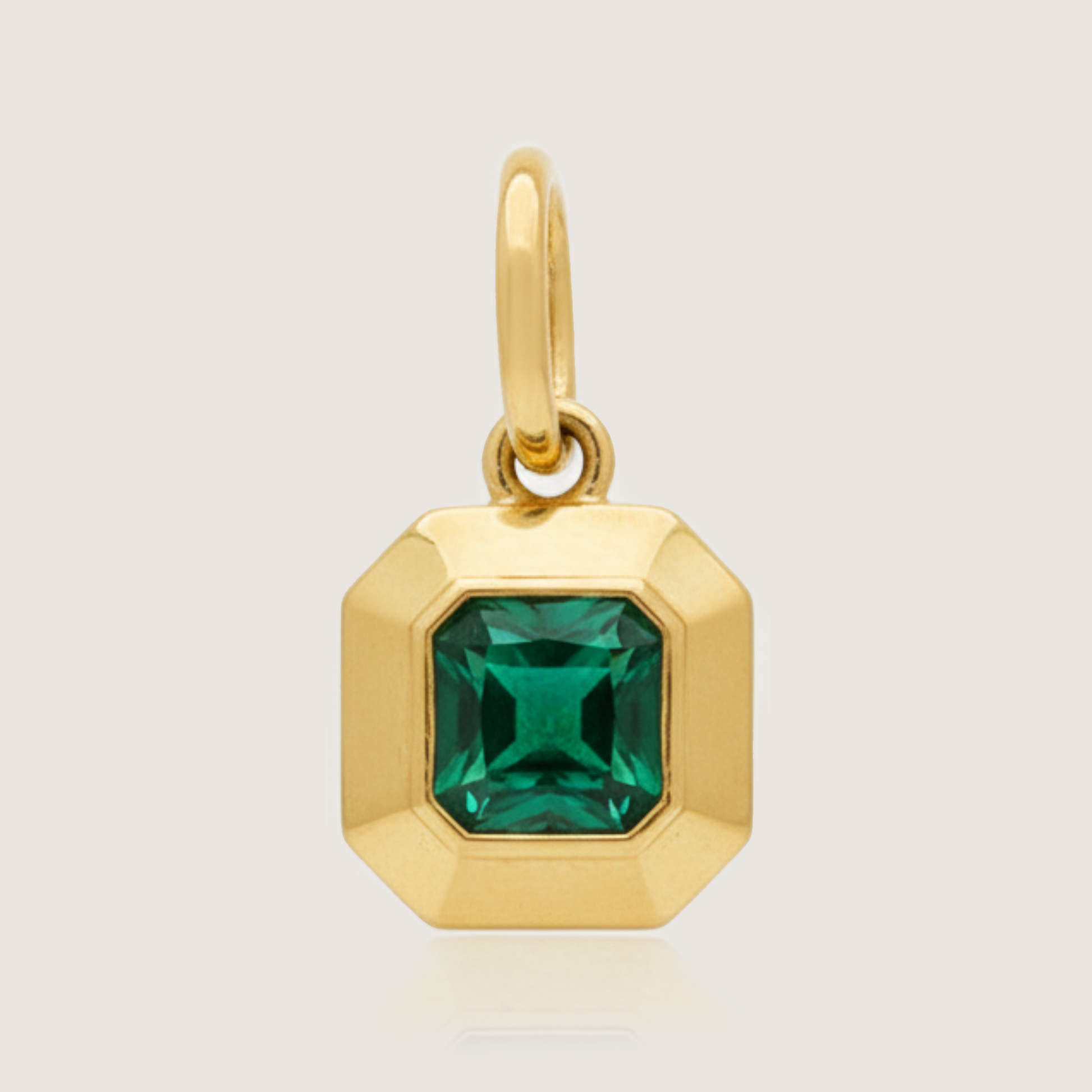 White Background - Front of KiraKira Emerald Charm | 925 Silver Gold-Plated from Nishani’s Kira Kira festive collection — handcrafted emerald jewelry, charm in gold-plated 925 silver.