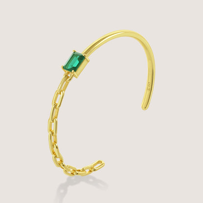 White Background - Front of KiraKira Emerald Cuff | 925 Silver Gold-Plated from Nishani’s Kira Kira festive collection — handcrafted emerald jewelry, bracelet in gold-plated 925 silver.