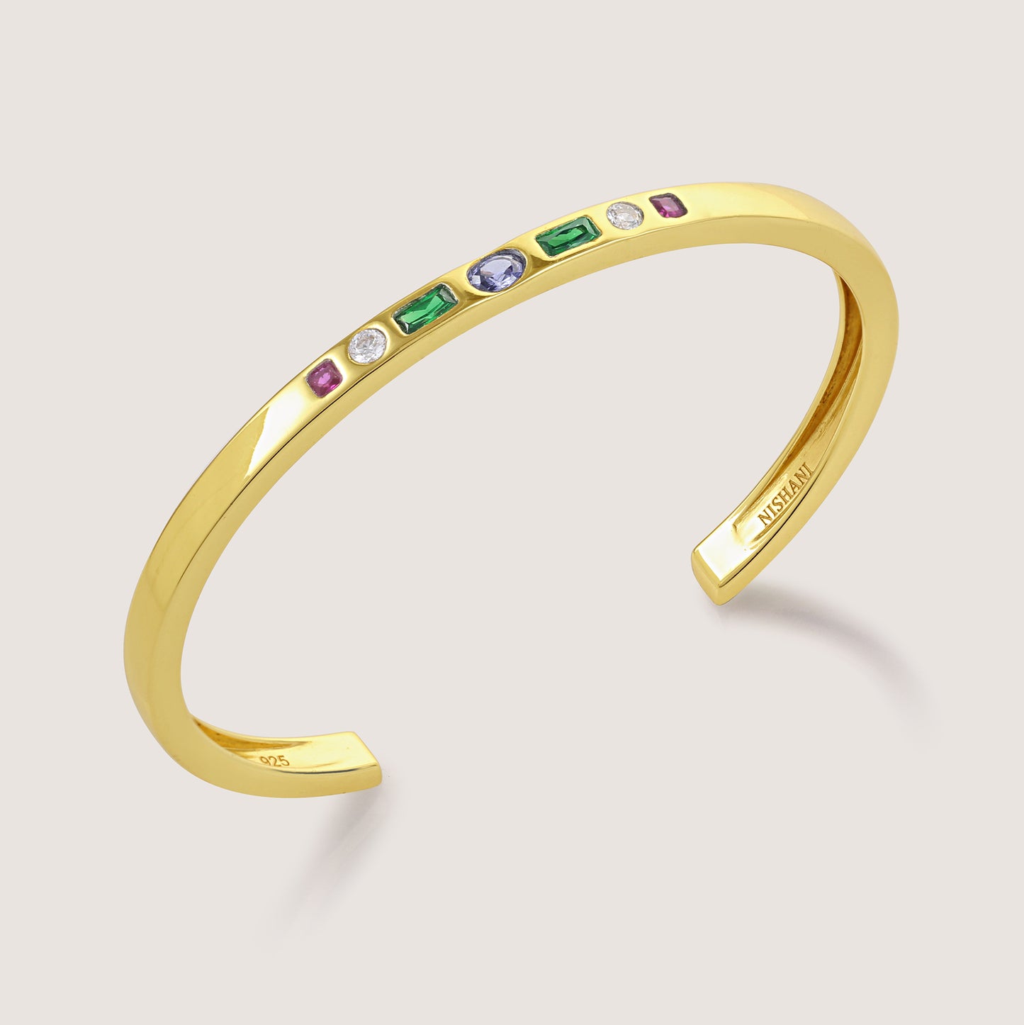 White Background - Front of KiraKira Multi-Colour Cuff | 925 Silver Gold-Plated CZ from Nishani’s Kira Kira festive collection — handcrafted multicolour stones jewelry, bracelet in gold-plated 925 silver.
