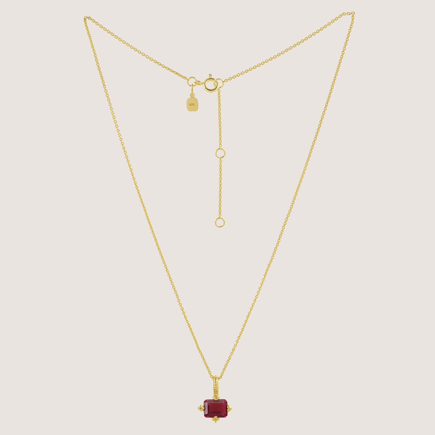 White Background - Front of KiraKira Ruby Suits Necklace | 925 Silver Gold-Plated from Nishani’s Kira Kira festive collection — handcrafted ruby jewelry, necklace in gold-plated 925 silver.