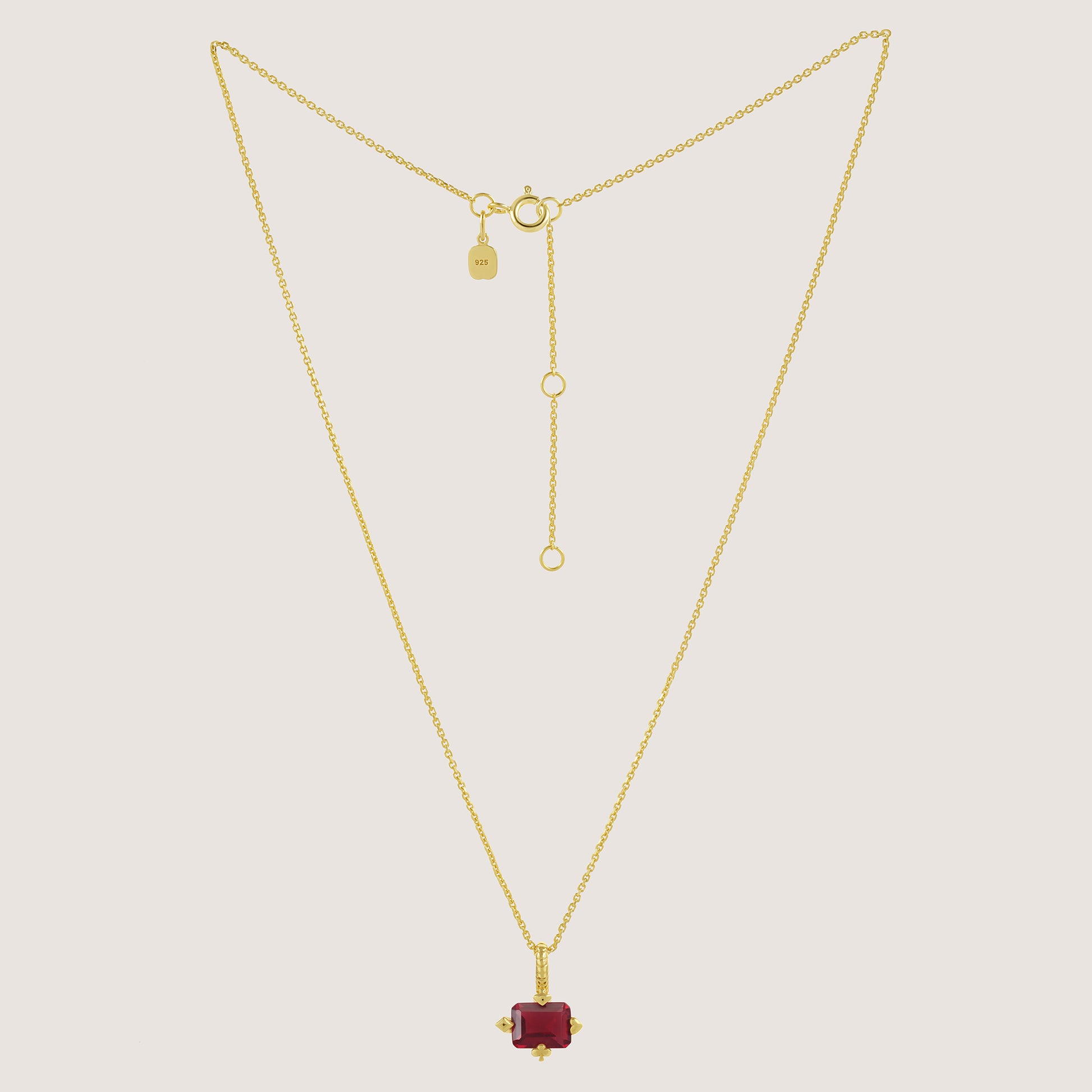White Background - Front of KiraKira Ruby Suits Necklace | 925 Silver Gold-Plated from Nishani’s Kira Kira festive collection — handcrafted ruby jewelry, necklace in gold-plated 925 silver.