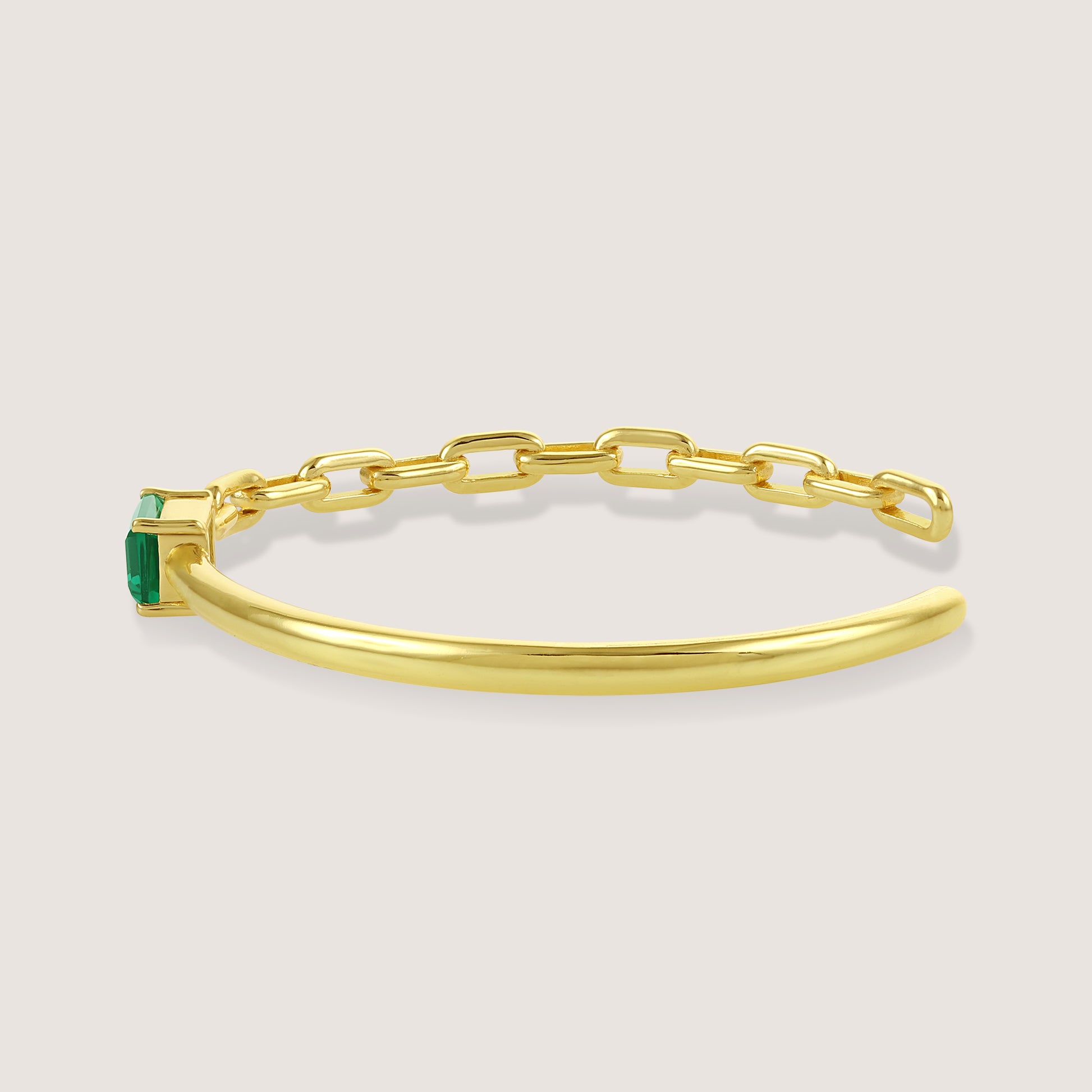 White Background - Side of KiraKira Emerald Cuff | 925 Silver Gold-Plated from Nishani’s Kira Kira festive collection — handcrafted emerald jewelry, bracelet in gold-plated 925 silver.