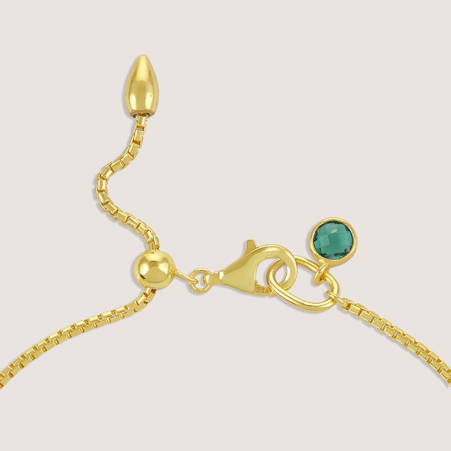 White Background - Side of KiraKira Emerald Hand Chain | 925 Silver Gold-Plated from Nishani’s Kira Kira festive collection — handcrafted emerald jewelry, bracelet in gold-plated 925 silver.