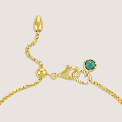 White Background - Side of KiraKira Emerald Hand Chain | 925 Silver Gold-Plated from Nishani’s Kira Kira festive collection — handcrafted emerald jewelry, bracelet in gold-plated 925 silver.