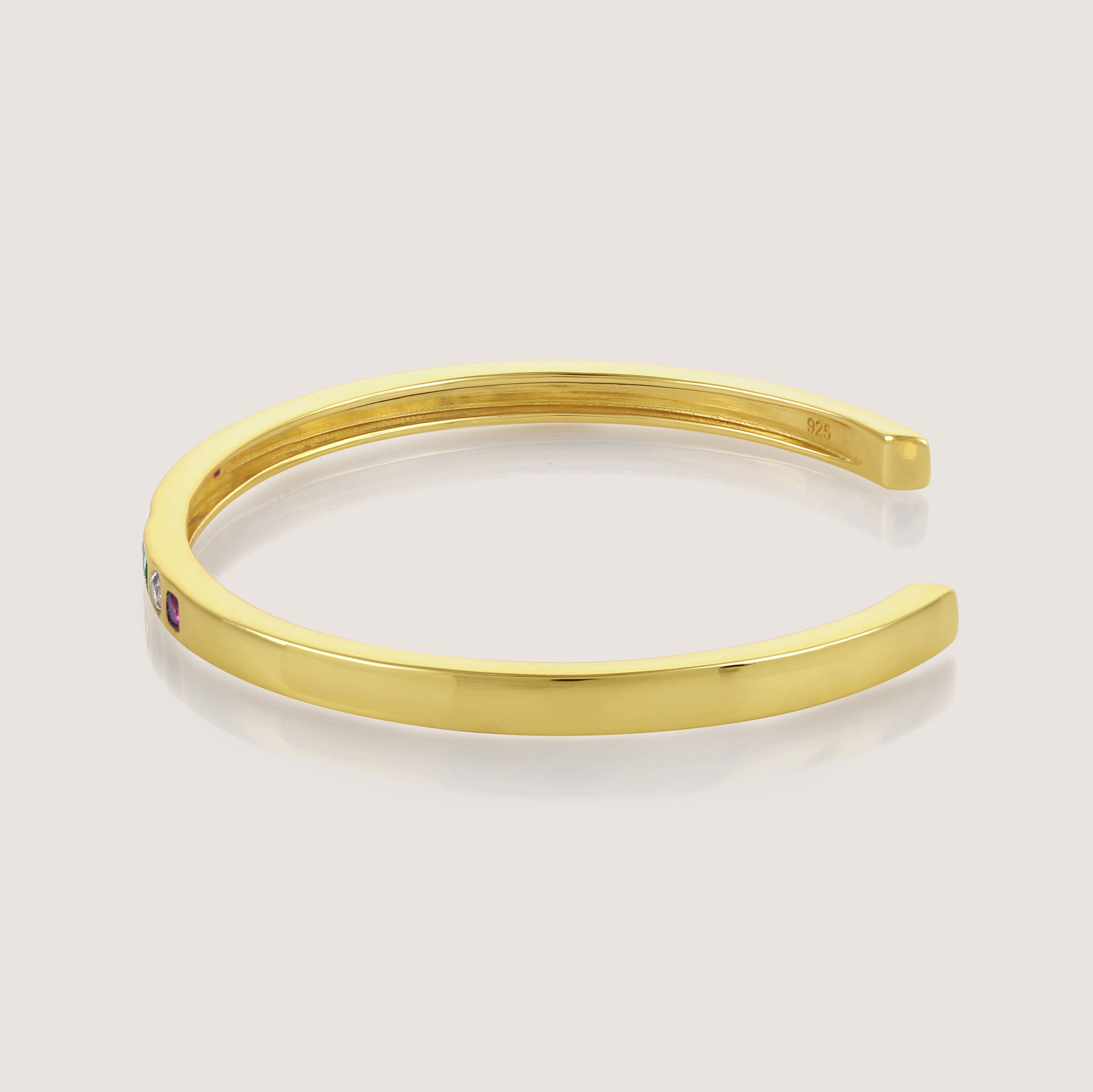 White Background - Side of KiraKira Multi-Colour Cuff | 925 Silver Gold-Plated CZ from Nishani’s Kira Kira festive collection — handcrafted multicolour stones jewelry, bracelet in gold-plated 925 silver.