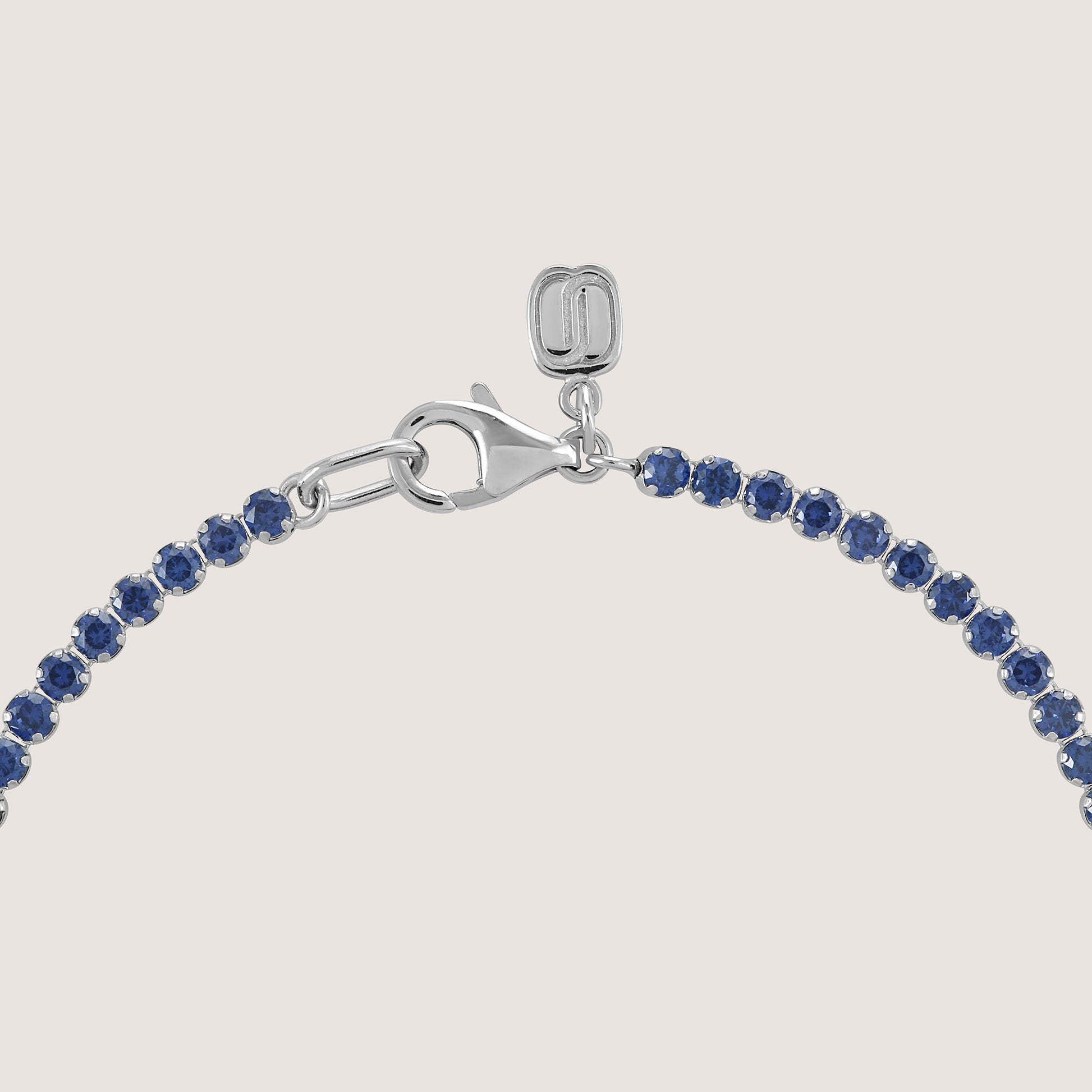 White Background - Side of KiraKira Tennis Bracelet Blue | 925 Silver Gold & Rhodium-Plated from Nishani’s Kira Kira festive collection — handcrafted bracelet in gold-plated 925 silver.