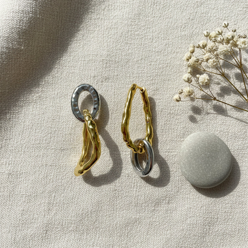 Yugen Asymmetrical Earrings – highlighting its bold dual-tone sophistication, part of Nishani’s Yugen Collection.