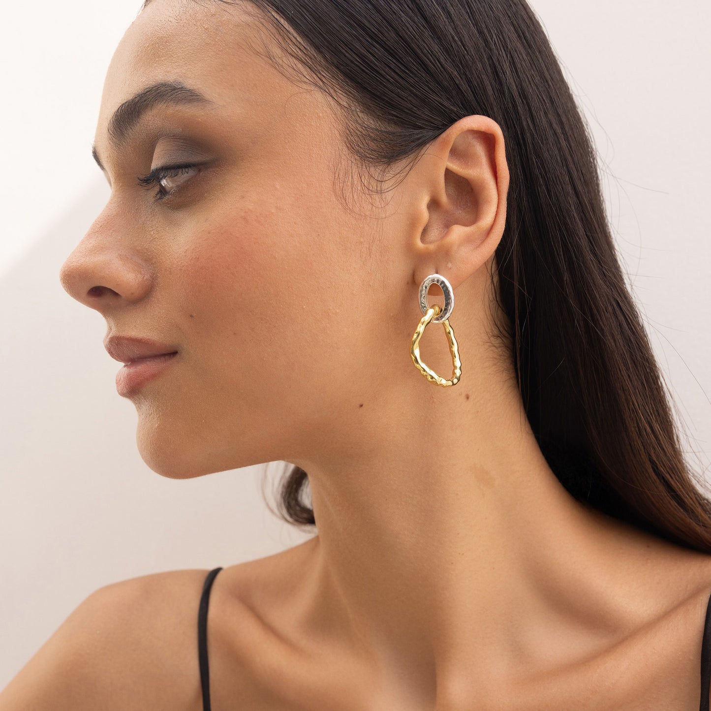 Yugen Asymmetrical Earrings – highlighting its bold dual-tone sophistication, part of Nishani’s Yugen Collection.