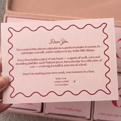 Card with text held in front of a pink calendar