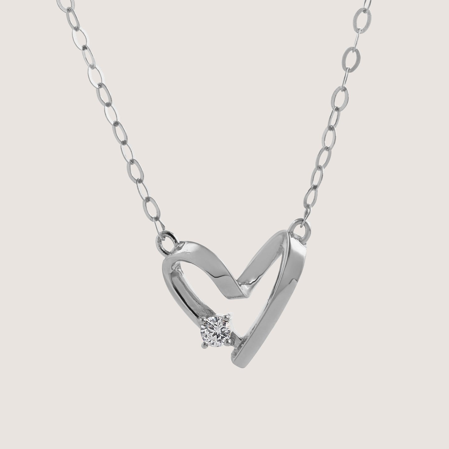 diamond heart necklace crafted in 925 sterling silver, available in gold and rhodium-plated finish