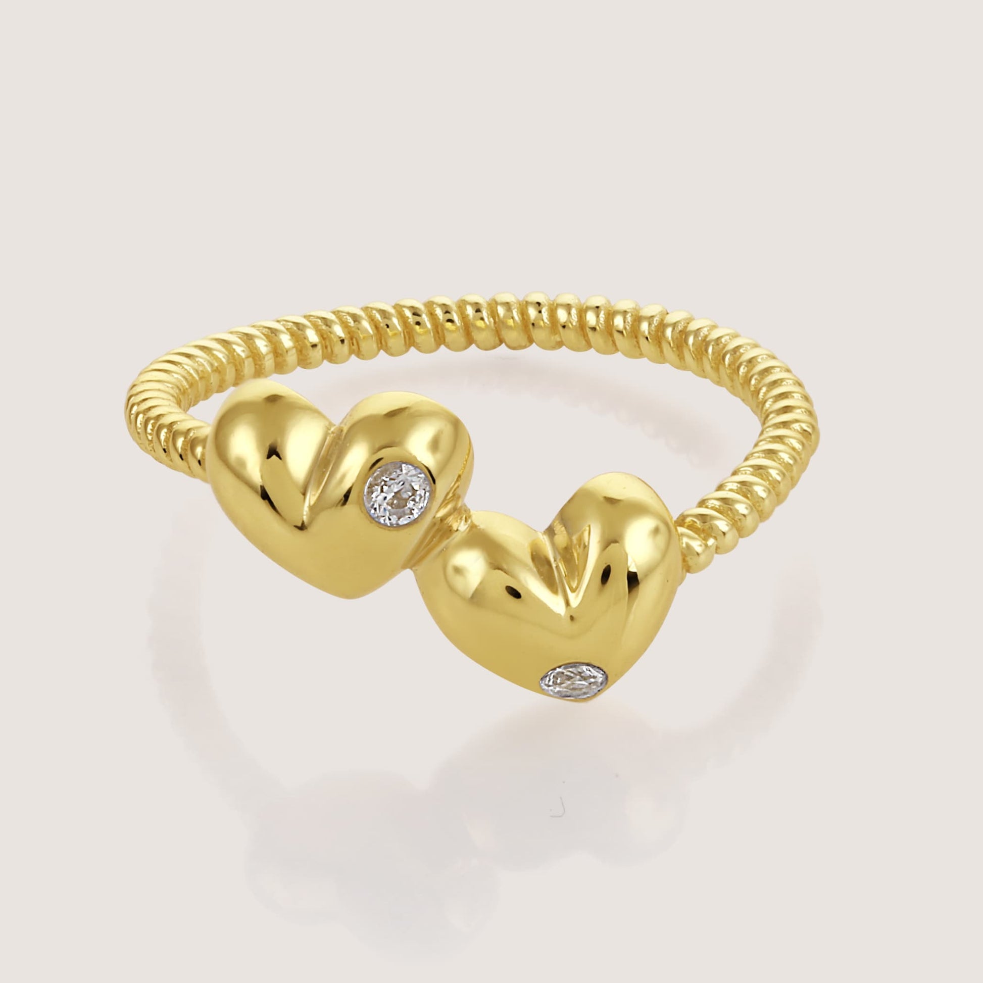 double heart ring crafted in 925 sterling silver, available in gold and rhodium-plated finish