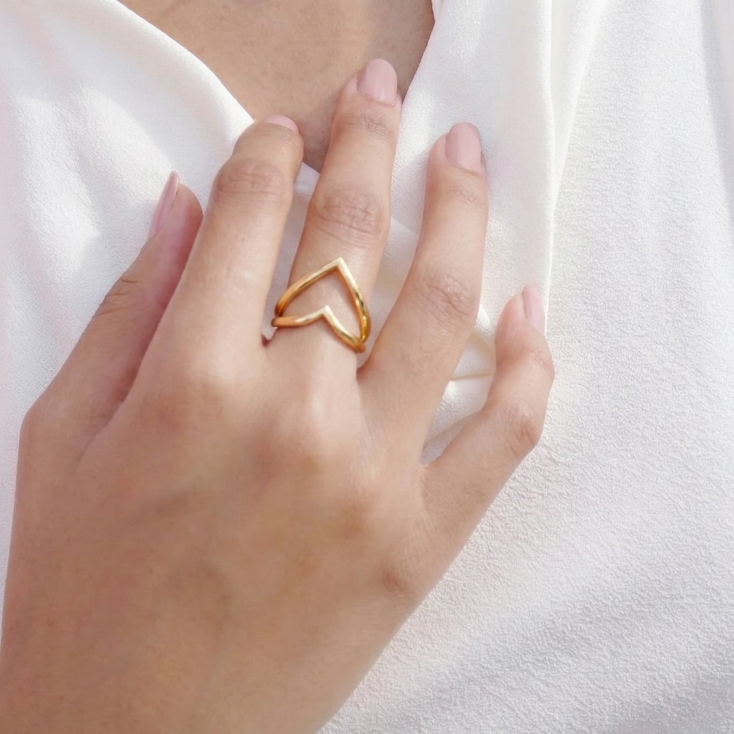 dual heart ring crafted in 925 sterling silver, available in gold and rhodium-plated finish