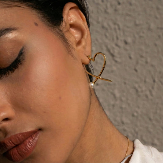 front-back heart earrings crafted in 925 sterling silver, available in gold and rhodium-plated finish, featuring a romantic heart-inspired design