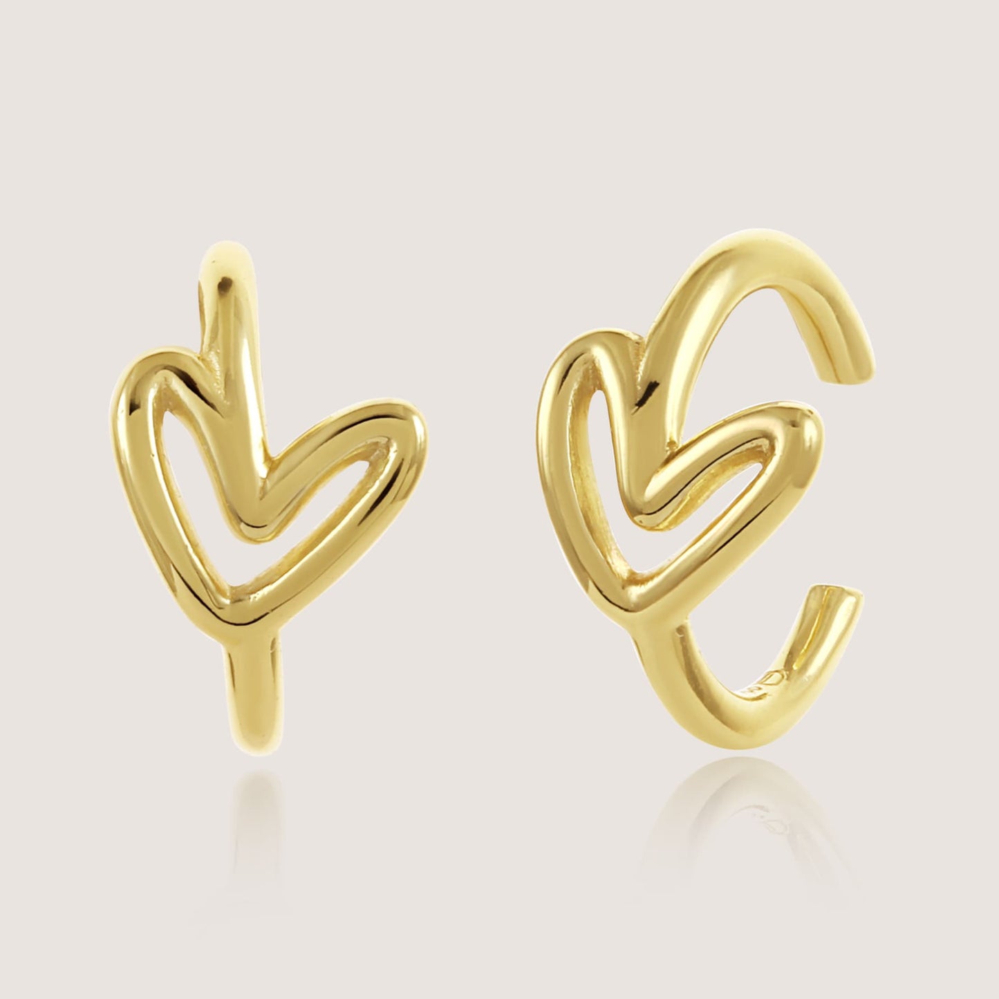 heart earcuffs crafted in 925 sterling silver, available in gold and rhodium-plated finish, featuring a romantic heart-inspired design