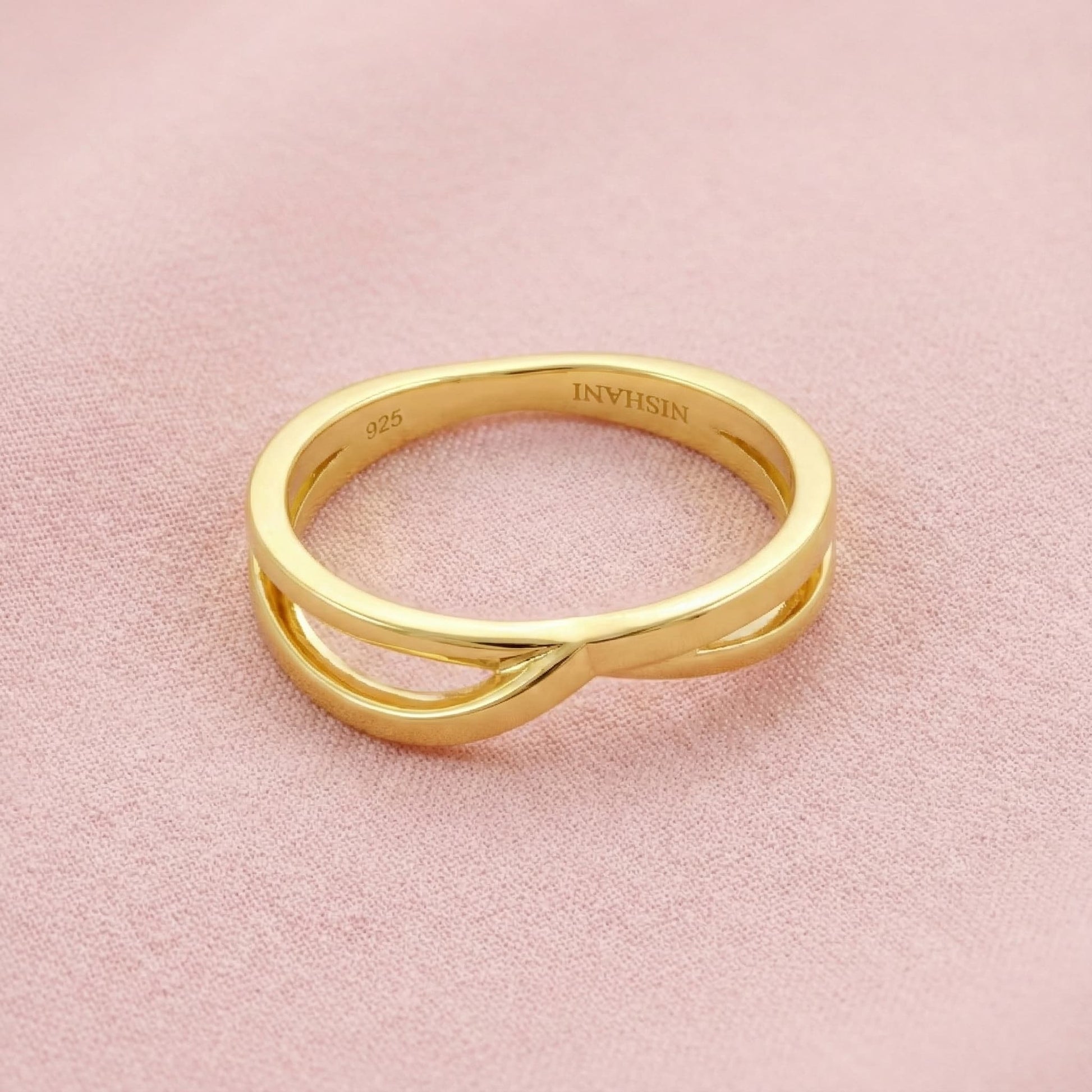 intertwined heart ring crafted in 925 sterling silver, available in gold and rhodium-plated finish