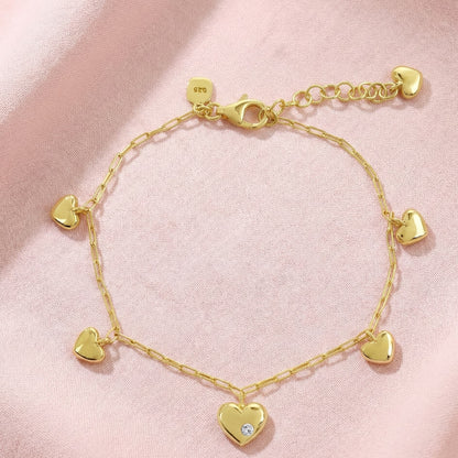 multi heart charm bracelet crafted in 925 sterling silver, available in gold and rhodium-plated finish