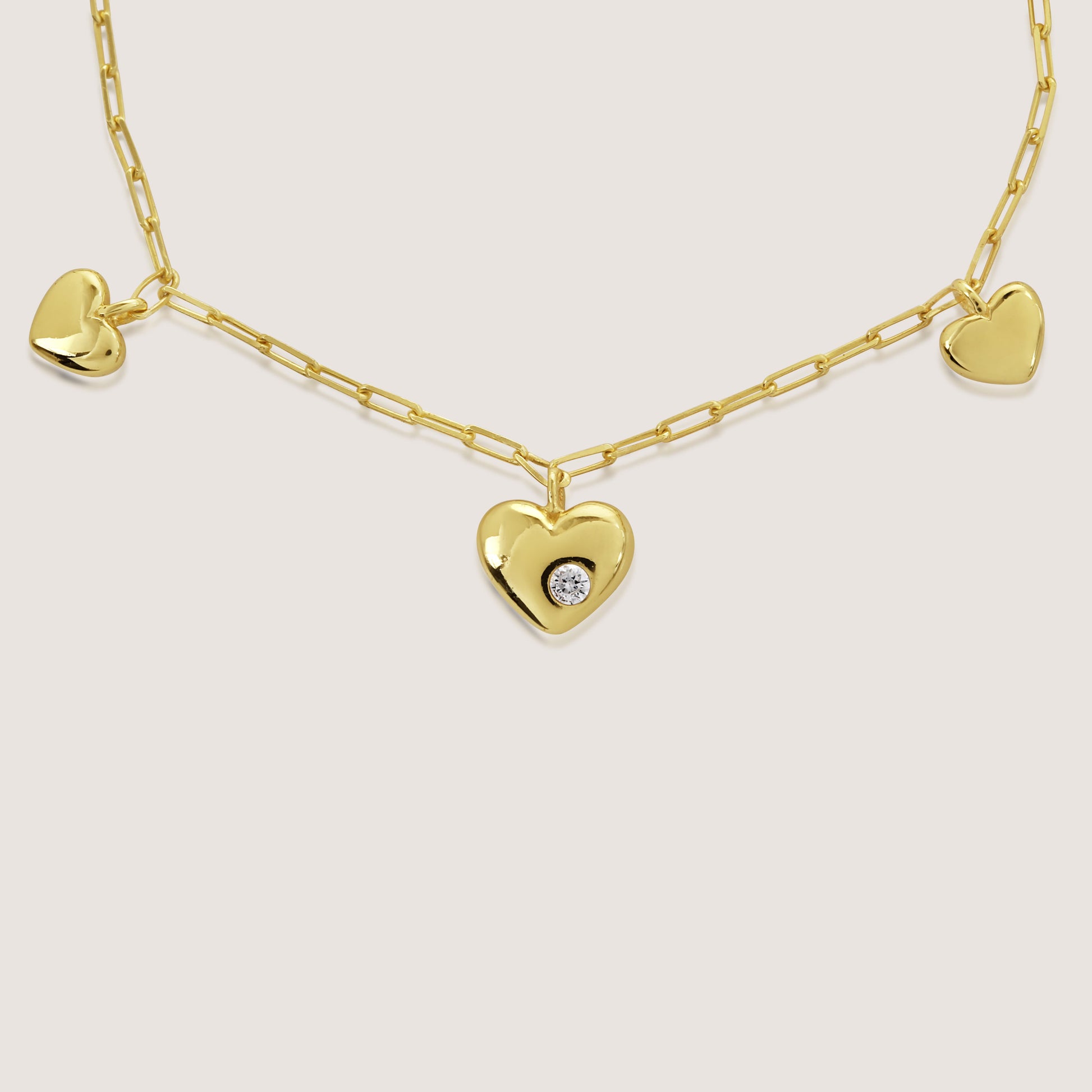 multi heart charm bracelet crafted in 925 sterling silver, available in gold and rhodium-plated finish
