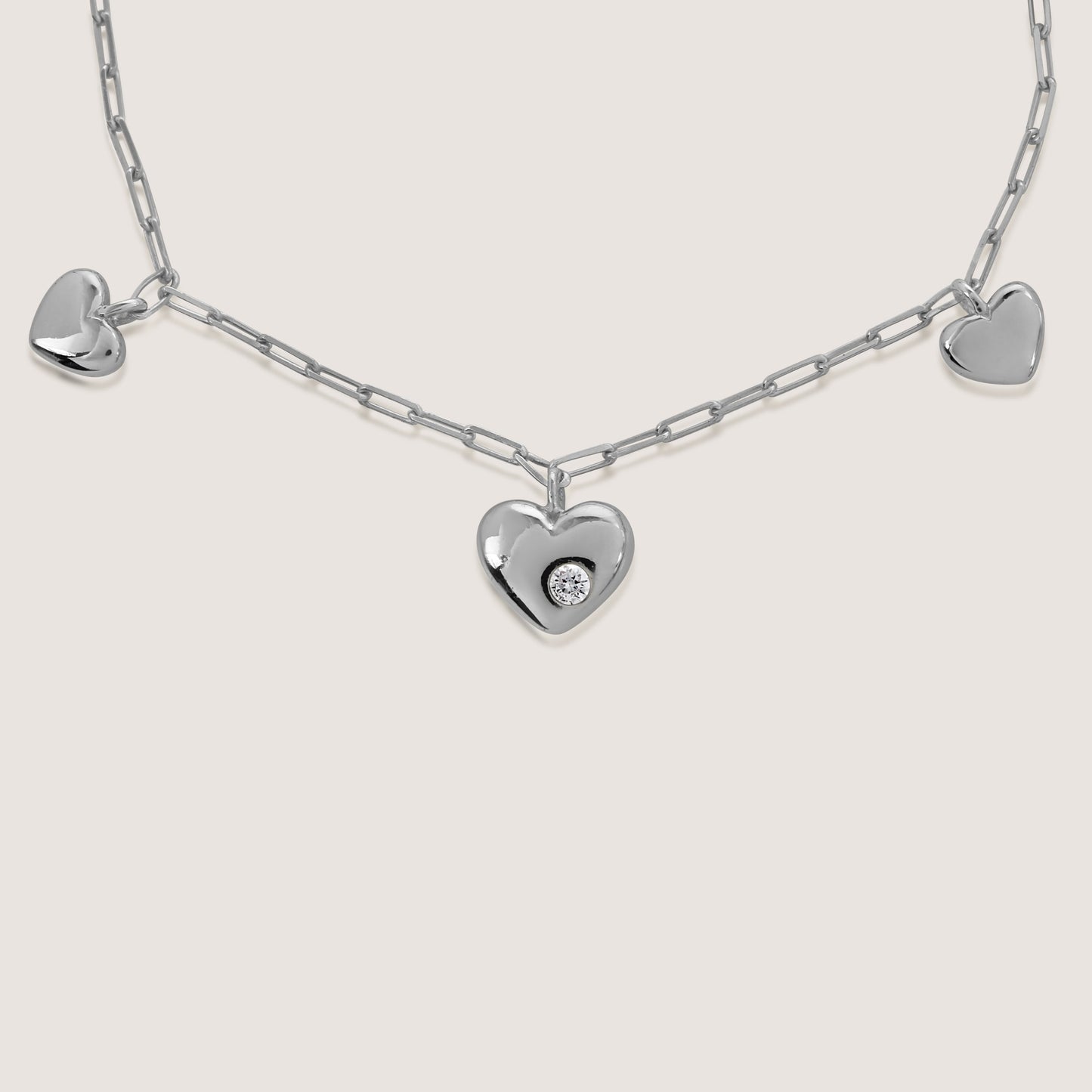 multi heart charm bracelet crafted in 925 sterling silver, available in gold and rhodium-plated finish