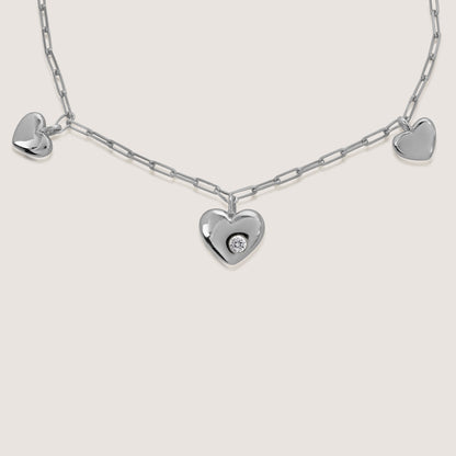 multi heart charm bracelet crafted in 925 sterling silver, available in gold and rhodium-plated finish