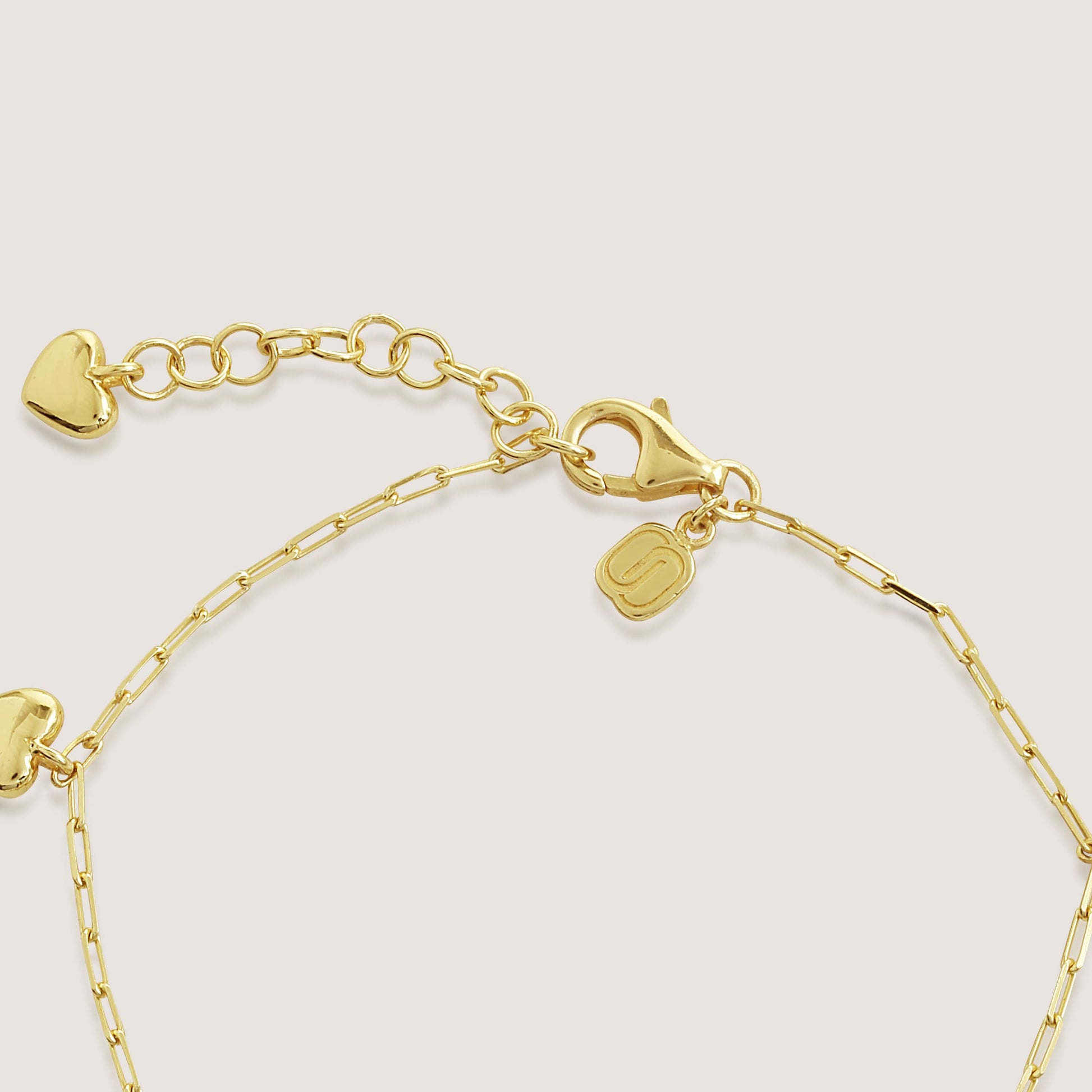 multi heart charm bracelet crafted in 925 sterling silver, available in gold and rhodium-plated finish