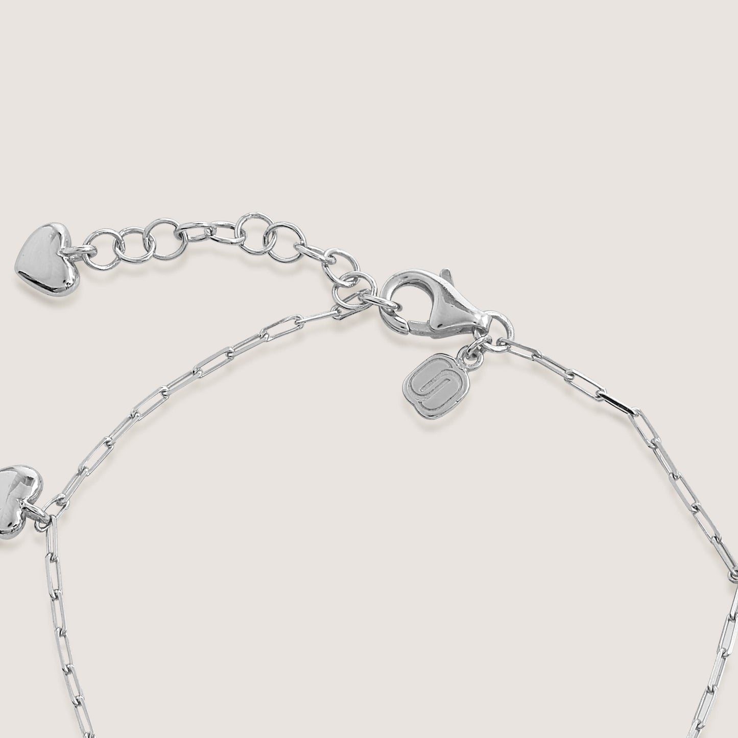 multi heart charm bracelet crafted in 925 sterling silver, available in gold and rhodium-plated finish